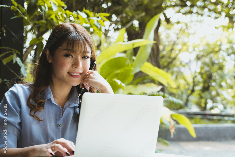 businesswoman working with computer in garden. freelance startup woman using laptop at home. businesswoman working with computer in garden. freelance startup woman using laptop at home.