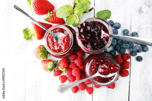 Obraz na plátně assortment of jams, seasonal berries, mint and fruits