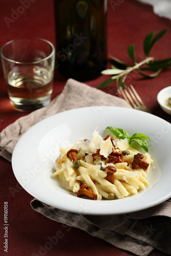 Creamy pasta with chanterelles on plate