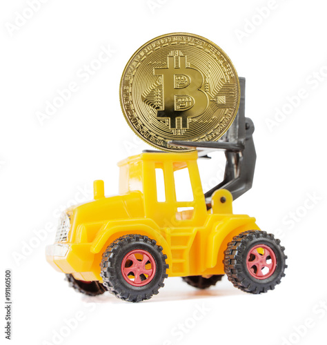 Yellow toy forklift carries...