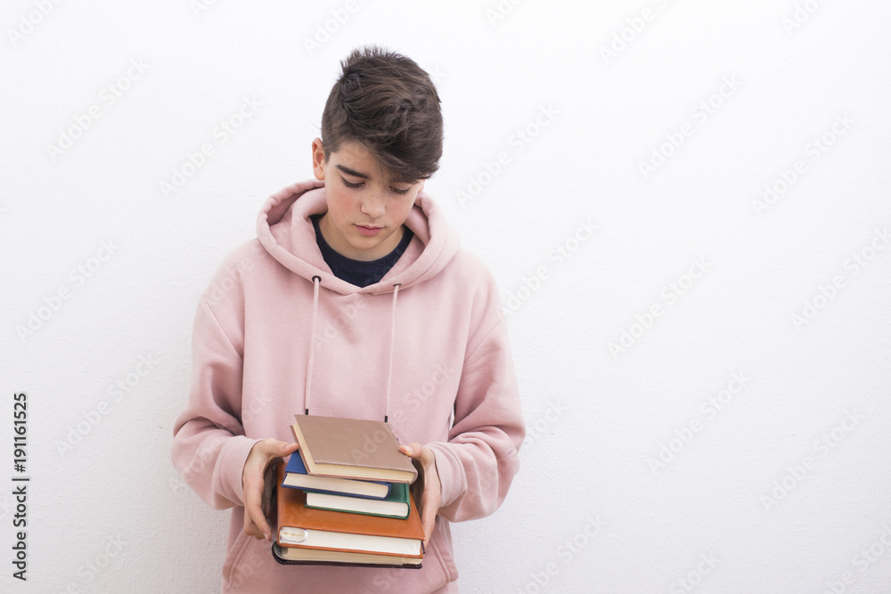 teenage student with books on the white wall teenage student with books on the white wall