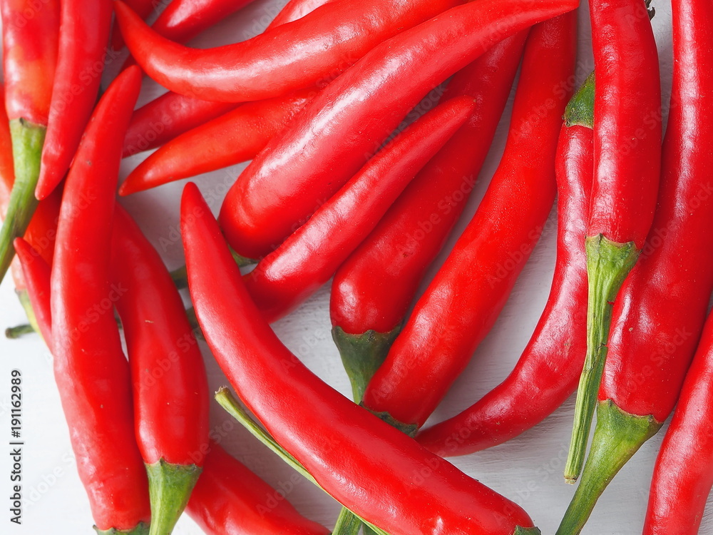 Culinary background. Red chili peppers closeup. Top view.