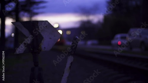 The train stops at the railway arrow. Evening time, spotlight. photo