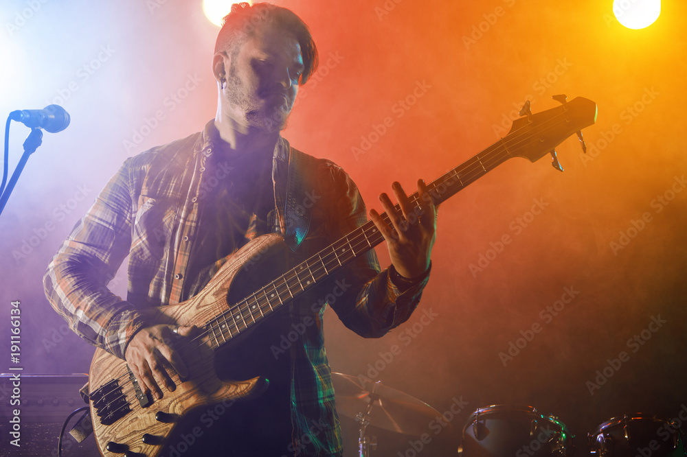 Obraz premium Bass player perform on stage.