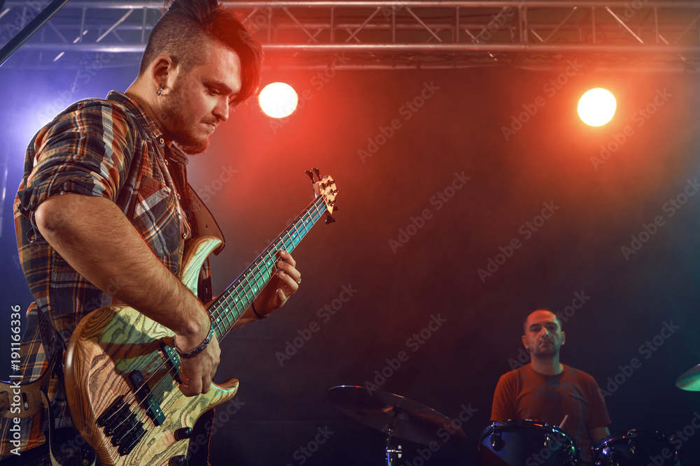 Obraz premium Bass player perform on stage.