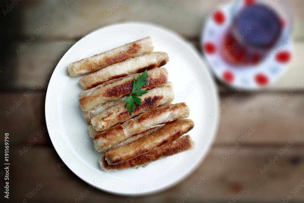 Sigara boregi 'cigarette borek' or kalem boregi 'pen borek', a smaller, cylindrical variety is often filled with feta cheese, potato, parsley and sometimes with minced meat or sausage. Sigara boregi 'cigarette borek' or kalem boregi 'pen borek', a smaller, cylindrical variety is often filled with feta cheese, potato, parsley and sometimes with minced meat or sausage.