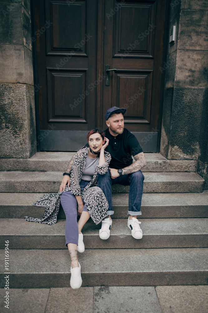 beautiful young couple sitting together on stairs in Dresden, Germany beautiful young couple sitting together on stairs in Dresden, Germany
