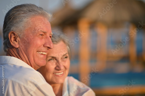 Beautiful happy elderly couple on beach 