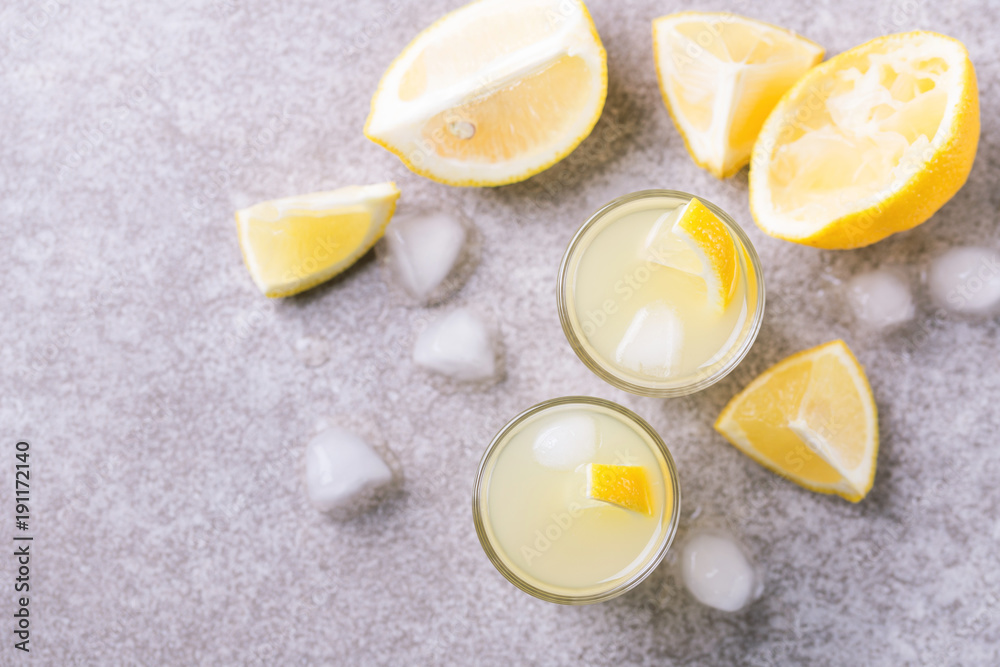 Italian lemon lime liqueur limoncello with ice and mint Italian lemon lime liqueur limoncello with ice and mint
