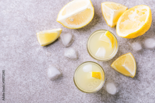 Italian lemon lime liqueur limoncello with ice and mint