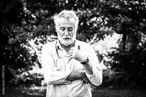 portrait of a senior man thinking about something