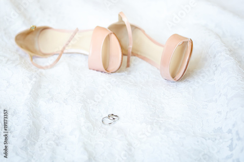 Wedding clothes of the bride: dress, shoes and rings
