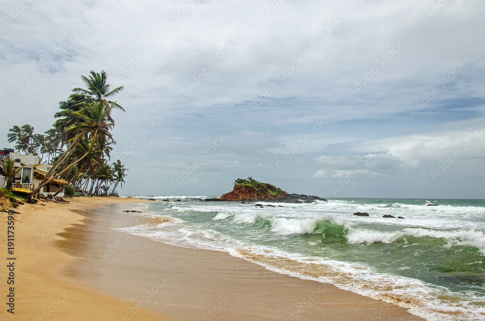Obraz premium Pure sandy beach and small island on the beach of Sri Lanka
