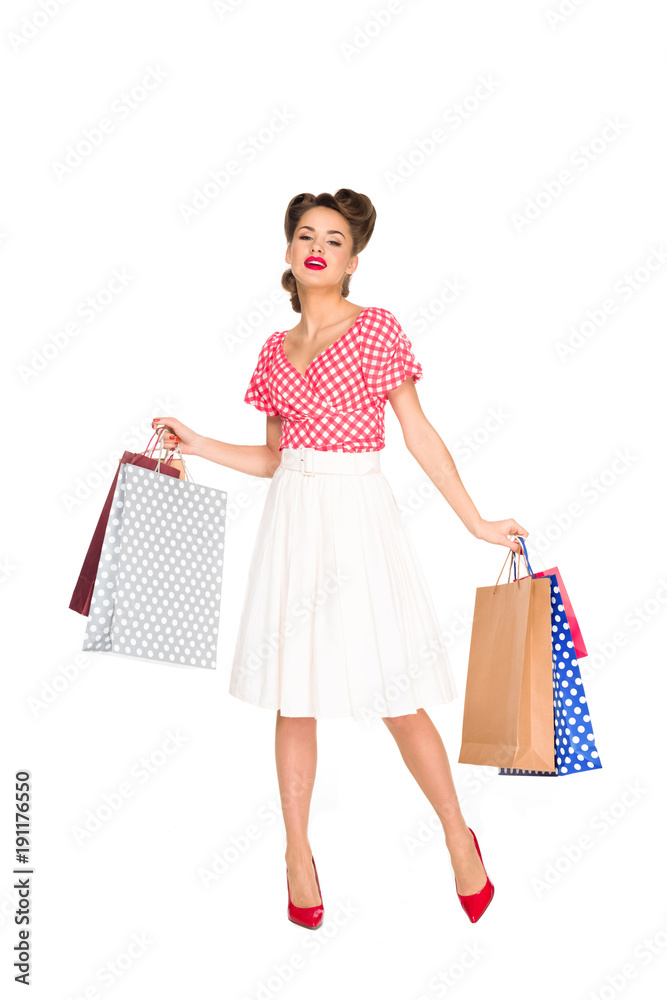 young woman in retro style clothing with shopping bags isolated on white young woman in retro style clothing with shopping bags isolated on white