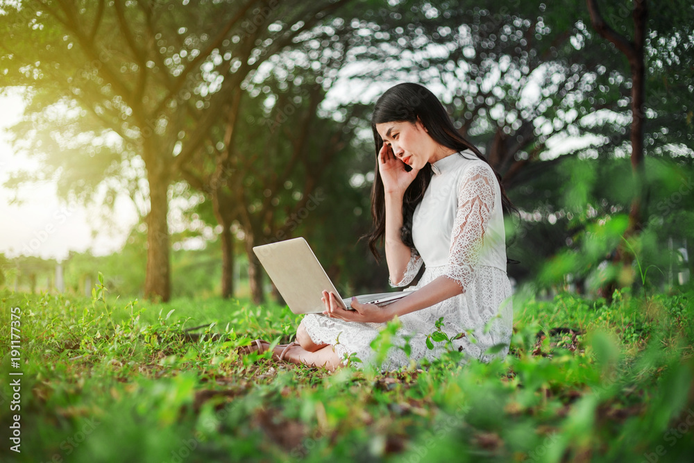 beautiful woman using laptop in the park beautiful woman using laptop in the park