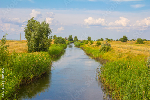 Russia, an irrigation canal along the fields photo