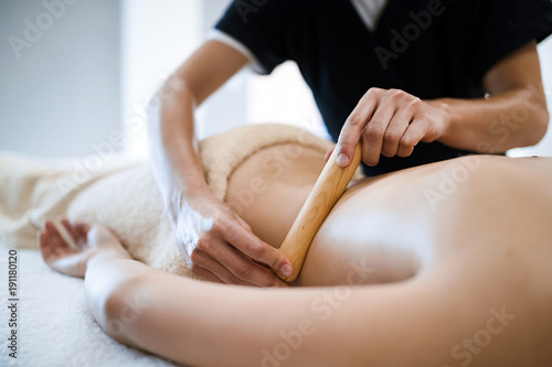 Thai massage therapist treating patient
