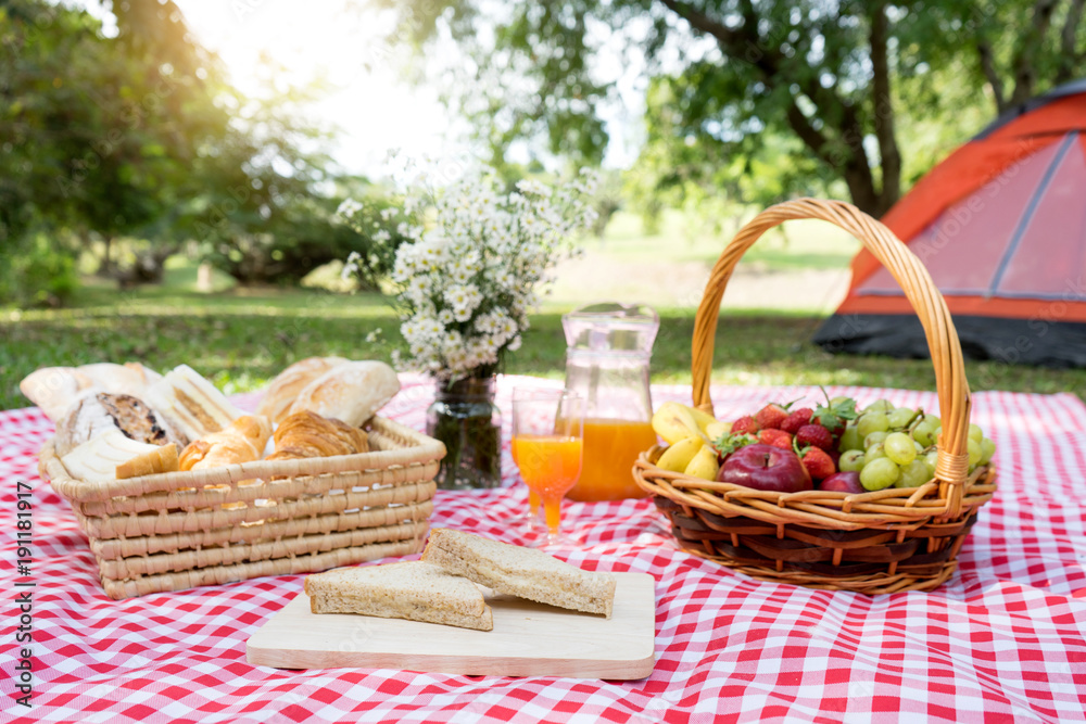 picnic bread crossiant basket with fruit on red white cloth picnic bread crossiant basket with fruit on red white cloth