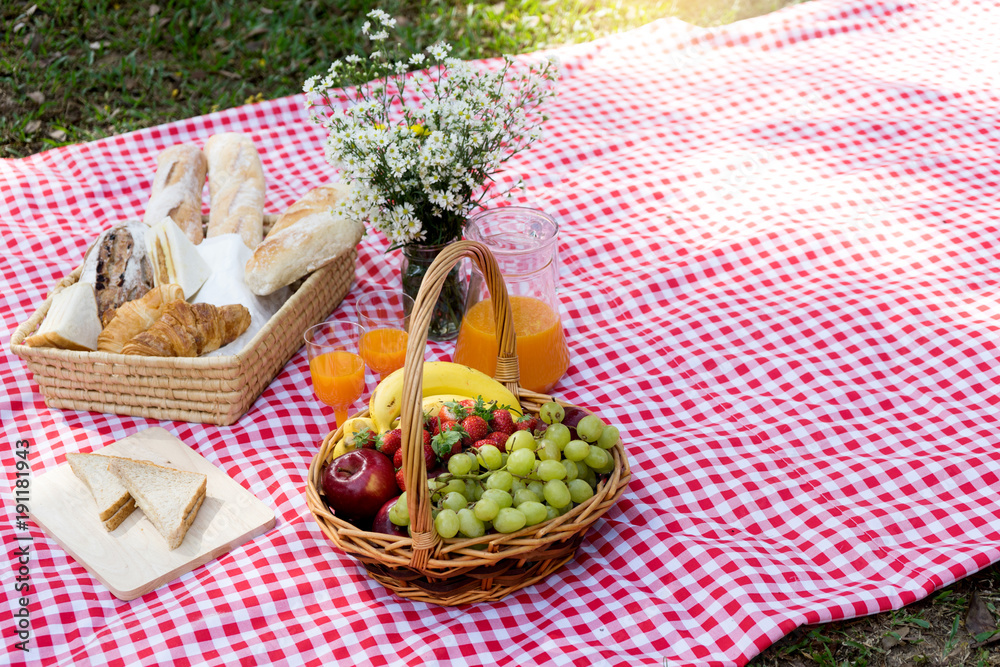 picnic bread crossiant basket with fruit on red white cloth picnic bread crossiant basket with fruit on red white cloth