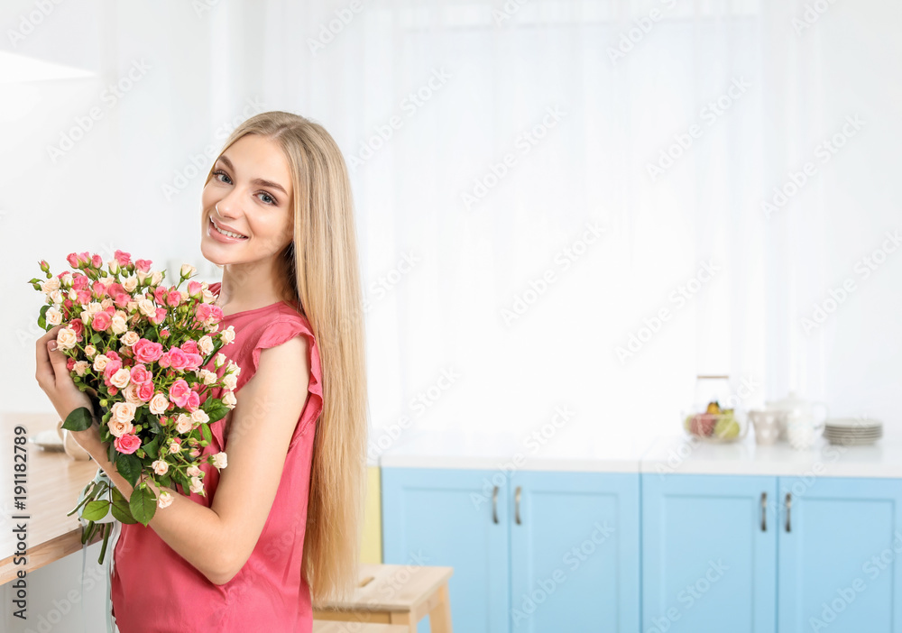 Beautiful young woman with bouquet of roses at home Beautiful young woman with bouquet of roses at home
