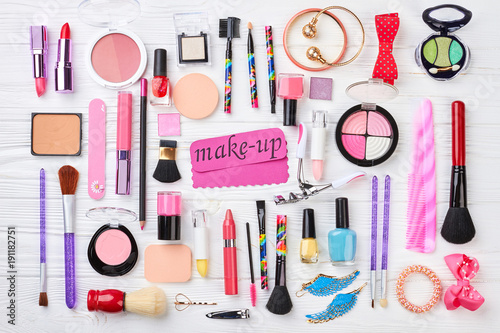 Set of cosmetics and accessories. Women fashion cosmetics and makeup tools, top view. Pink paper message and make up products.
