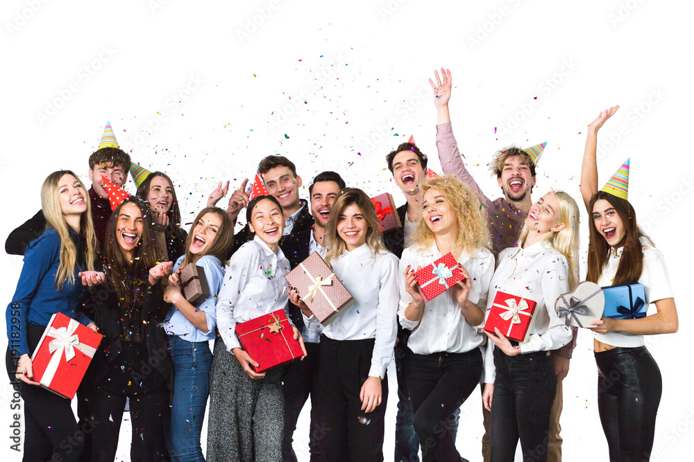 Obraz premium Cheerful joyful young people friends standing and celebrating together over white background.
