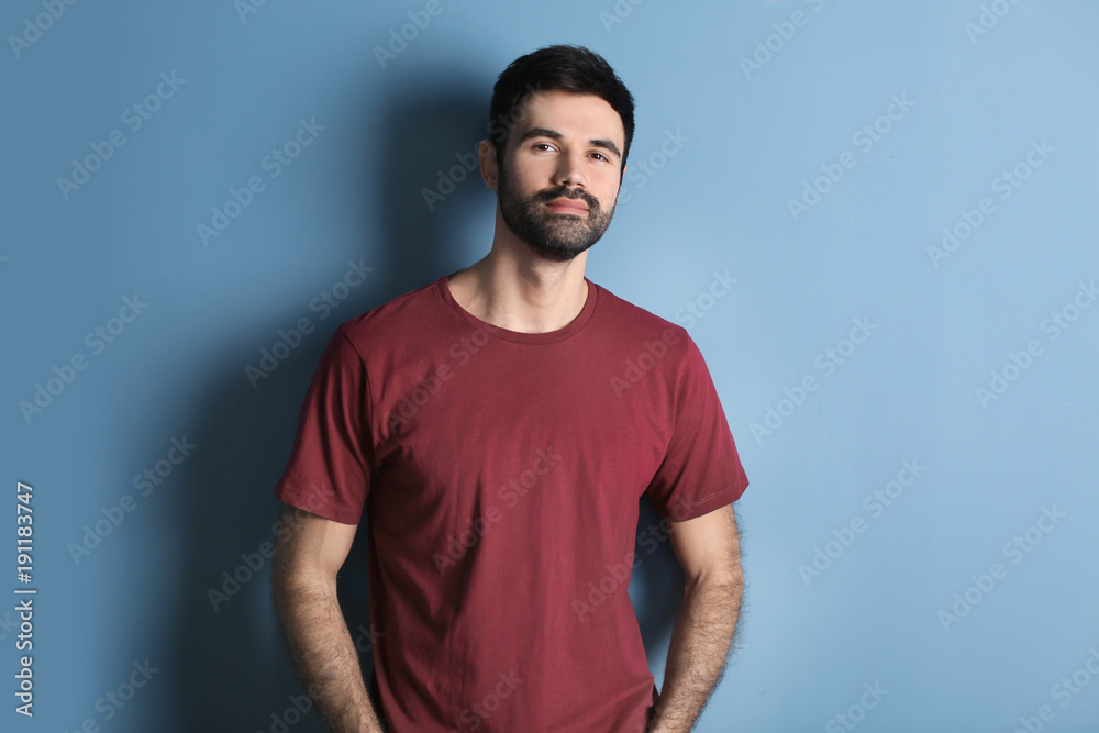 Fototapeta premium Young bearded man in casual clothes on color background