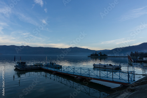 Last evening light reflecting in the calm waters of the Danube as it reaches the Romanian town of Orsova