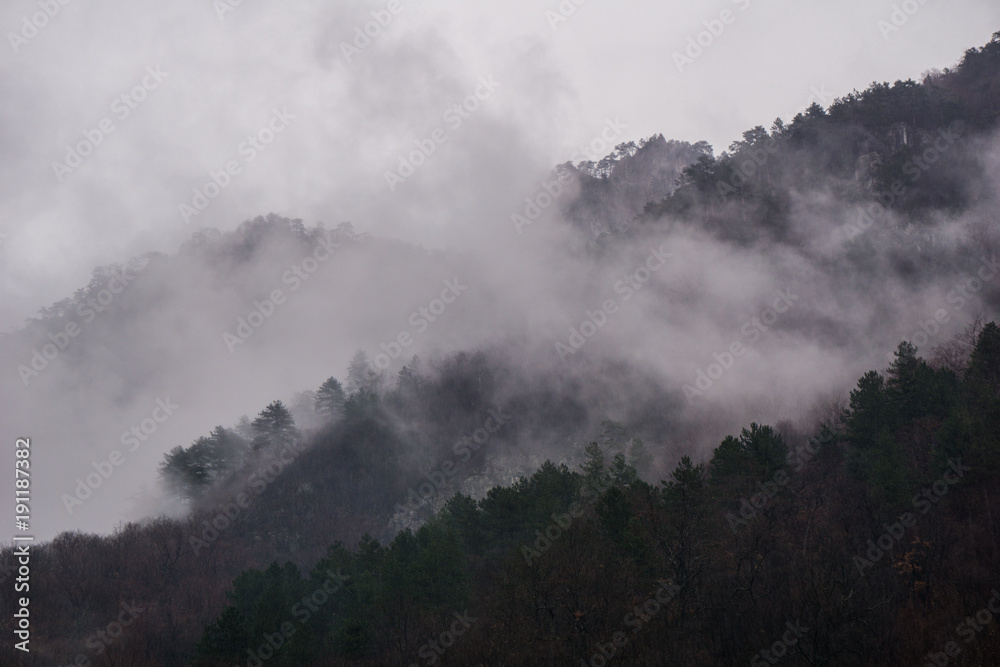 Heavy fog rising from the Cerna Mountains near the resort town of Baile Herculane