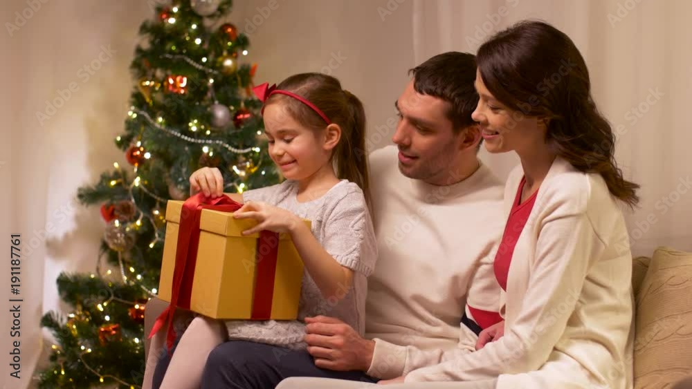 happy family with christmas present at home happy family with christmas present at home