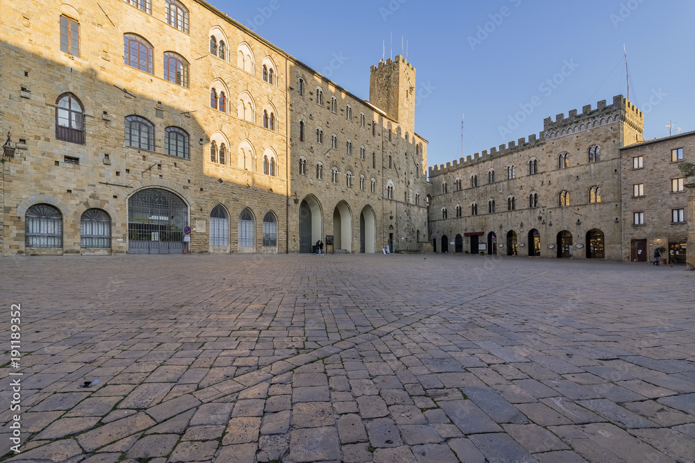 Pretorio Palace and Porcellino Tower, Priori square in a quiet moment of the afternoon, Volterra, Pisa, Tuscany, Italy