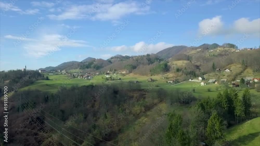 Aerial: Drone flying high and showing beautiful Slovenian landscape. Full of hills and forests with houses everywhere. Aerial: Drone flying high and showing beautiful Slovenian landscape. Full of hills and forests with houses everywhere.