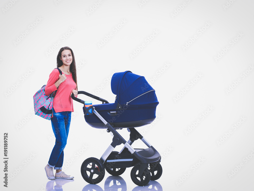 Full length portrait of a mother with a stroller, isolated on white background. Young mom Full length portrait of a mother with a stroller, isolated on white background. Young mom