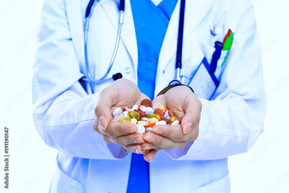 Doctor holding heap of drugs in a hand. Woman doctor Doctor holding heap of drugs in a hand. Woman doctor