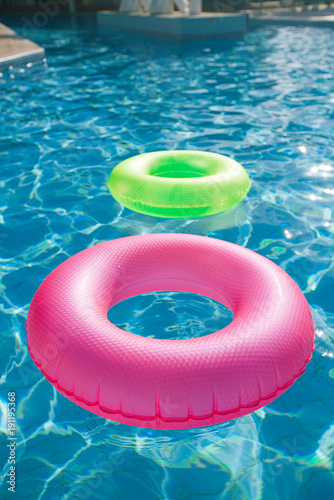floating rings on blue water swimpool