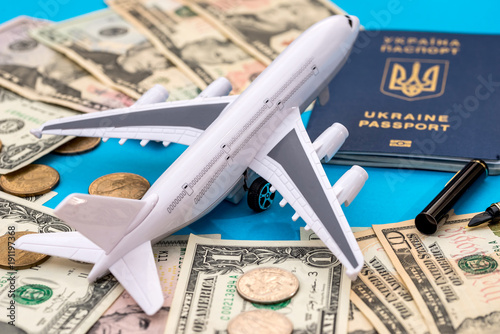 Travel concept - plane, money and passport