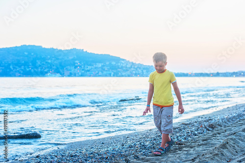 Kid boy walking at Alania b...