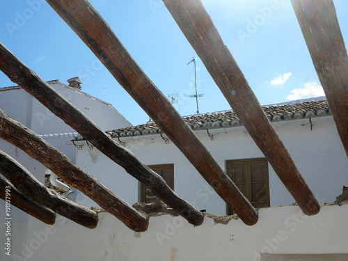 Roof beams agaist blue sky photo