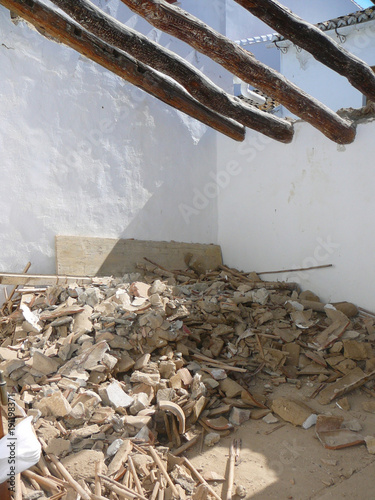 Exposed Roof beams and old tile debries photo