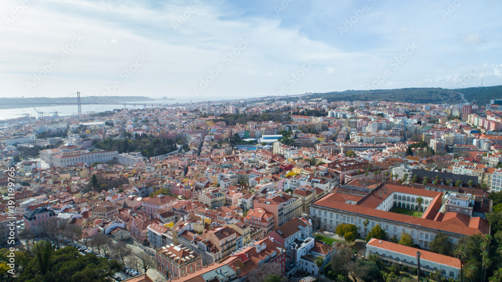 Fototapeta premium Panoramic view of Lisbon,Portugal town center form the of the many viewpoints parks.Architecture and culture in Europe.Tourist attraction.Beautiful view form the miradouro to the river and the bridge