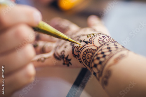 a picture of a mehendi on the arm photo