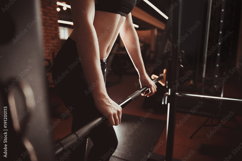 Φωτογραφία Barbell, girl is preparing for lesson with barbell, concept body fitness