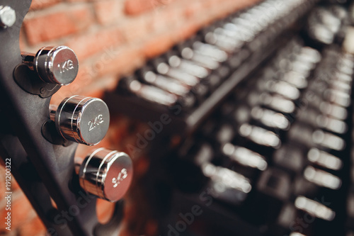 Dumbbell. Stand Rows of dumbbells in gym with loft modern gym