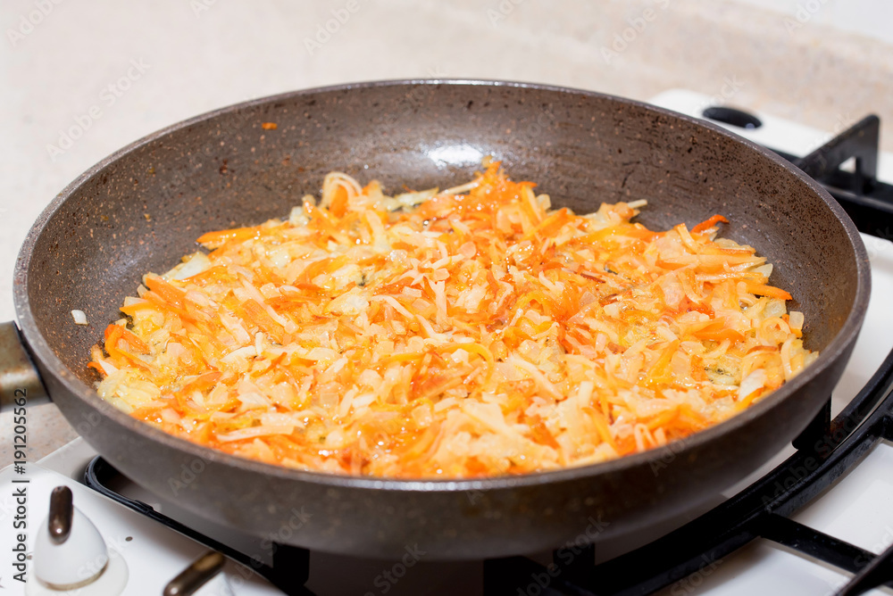 Frying pan with roasted vegetables for borscht Frying pan with roasted vegetables for borscht