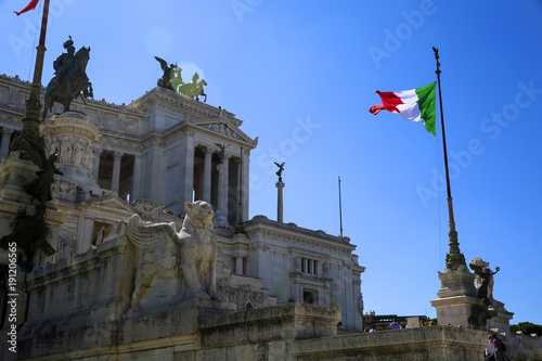 View of Italian national flag in front of Altare della Patria (Altar of the Fatherland) , the equestrian sculpture of Victor Emmanuel