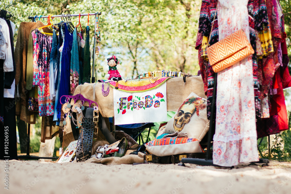 Flea market, shop on street clothes, bazaar festival
