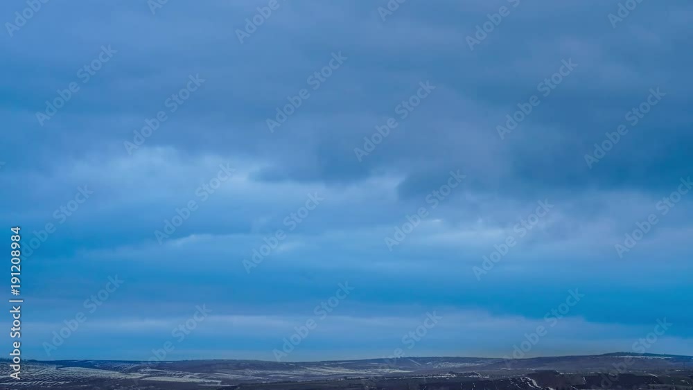 Time Lapse of clouds moving over the winter landscape near Time Lapse of clouds moving over the winter landscape near