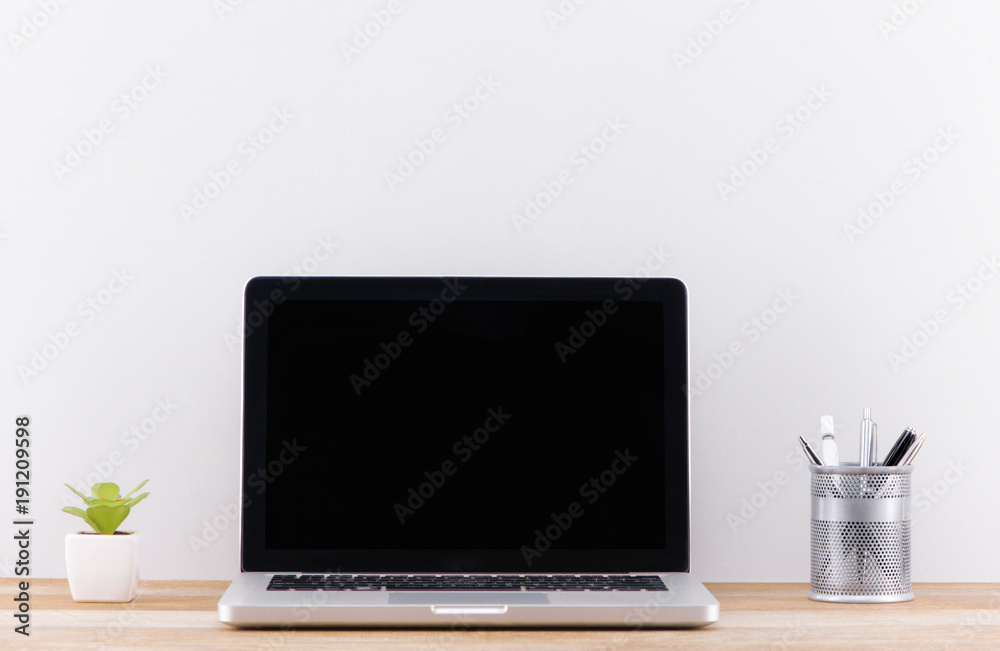 laptop computer white blank screen on work table front view laptop computer white blank screen on work table front view