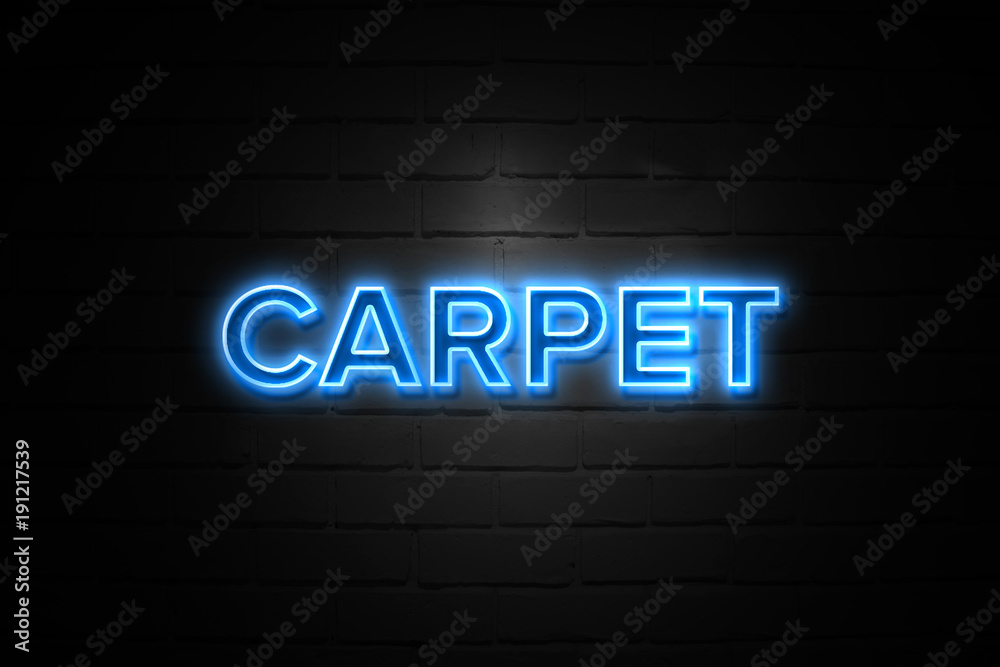 Carpet neon Sign on brickwall
