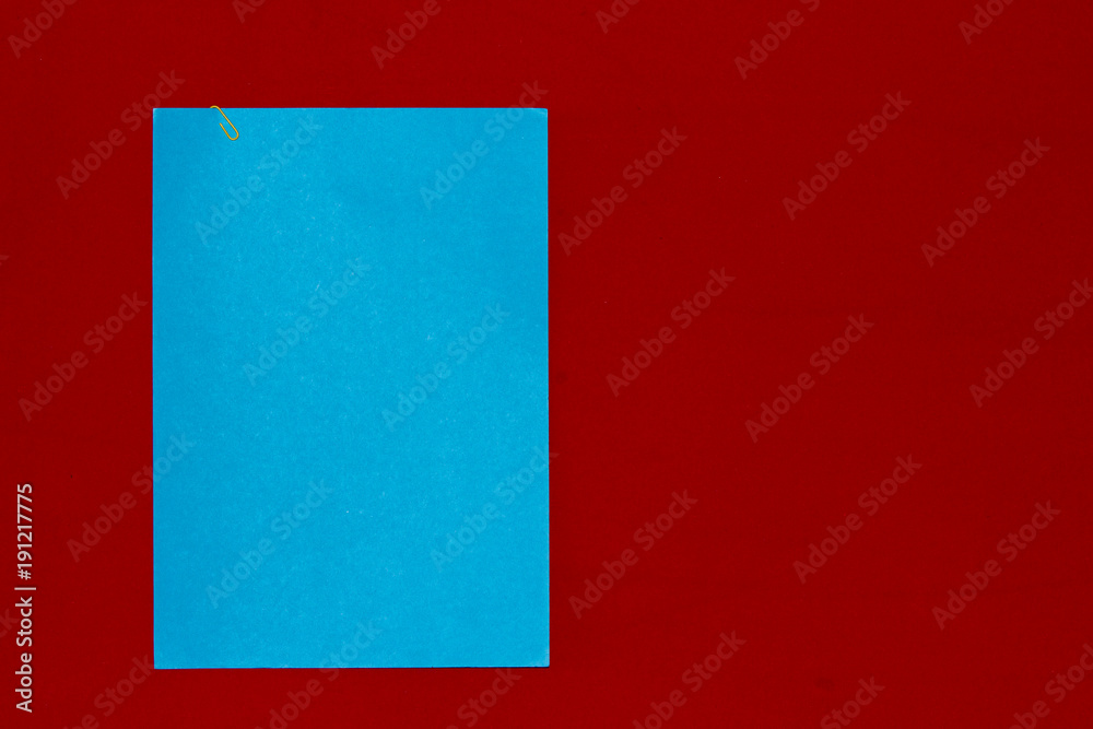 Blue paper on red frieze fabric